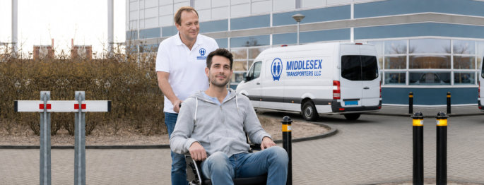 Father Pushing Son On Wheelchair With Van In Background 