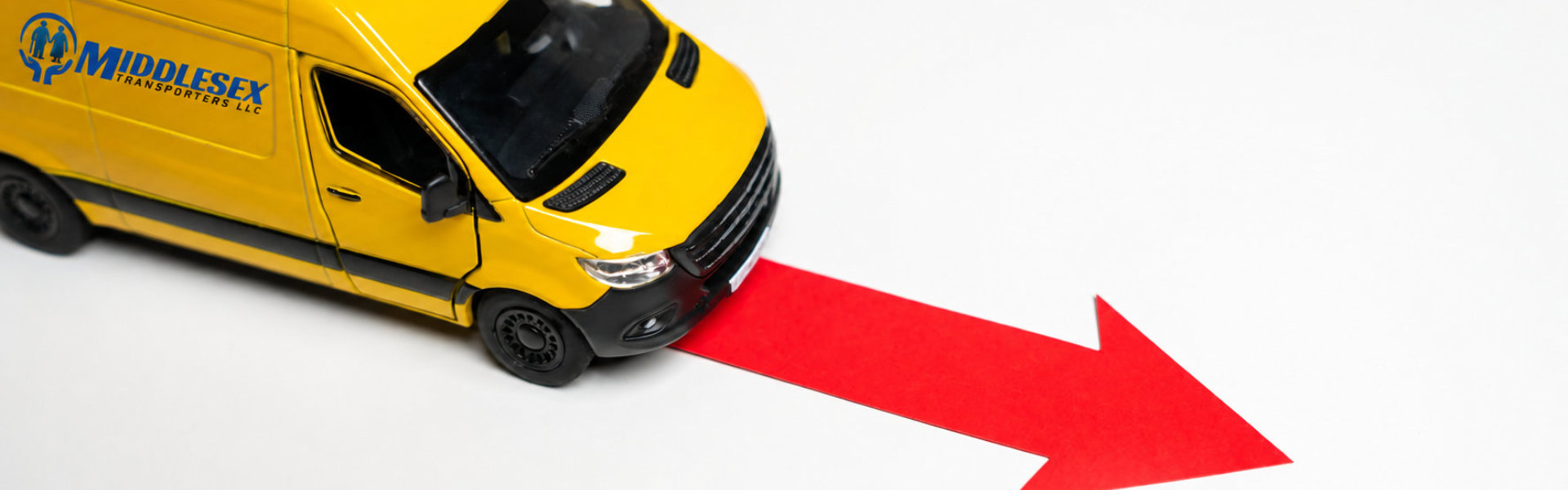 Yellow Toy Van Following a Red Arrow