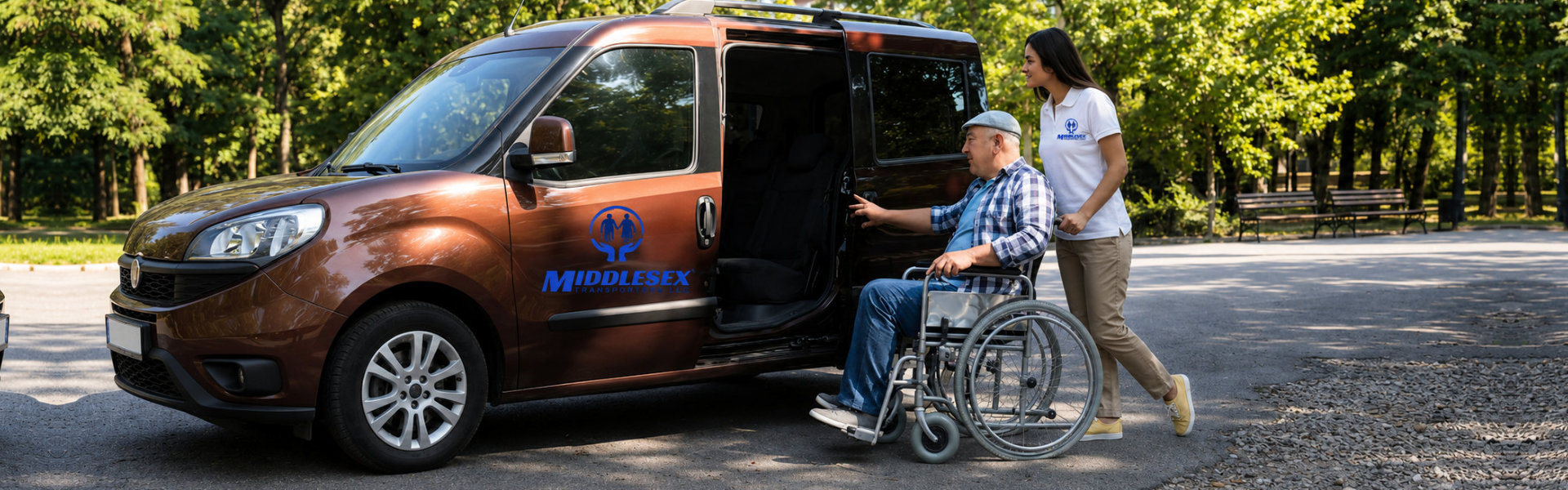 A woman assists a man using a wheelchair as he prepares to enter a maroon van. The woman, with long dark hair, is wearing a brown dress and yellow sneakers, and gently pushes the wheelchair. The man, wearing a hat and plaid shirt, reaches for the van door handle. The van's sliding door is open, revealing dark interior seats. This image highlights themes of assistance, accessibility, and support. The photo would be fitting for projects related to elder care, disability services, and inclusive transportation.